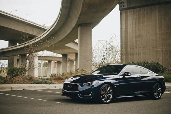 Black Infiniti coupe in parking lot