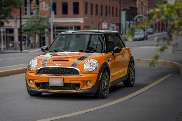 Orange Mini Cooper on city street