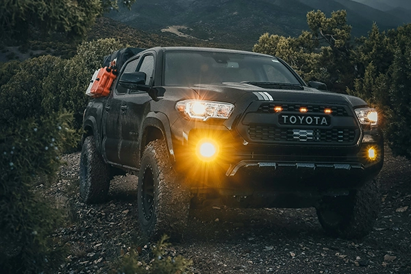 Black Toyota Tacoma off-roading